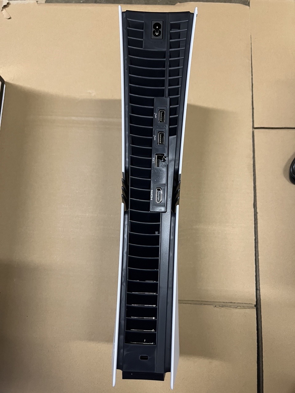 Rear of a PlayStation 5 Pro console showing power, USB, network and HDMI connections